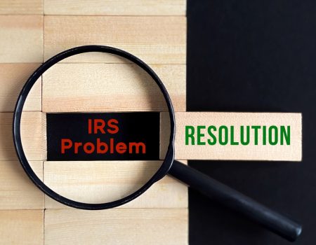 Business,Concept,-,Irs,Problem,Resolution,With,Magnifying,Glass,Background.